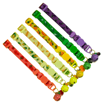 Six patterned cat collars with matching bells and vegetable charms
