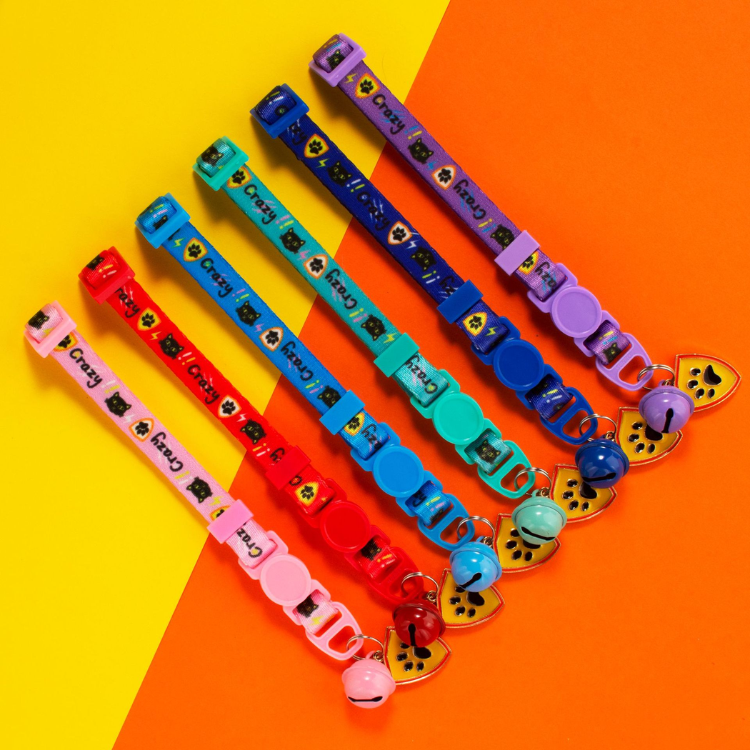 Colorful cat collar variants with bells and paw-print shield charms