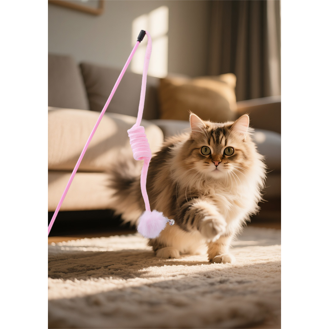 Cat reaching toward a pink wand toy in a living room