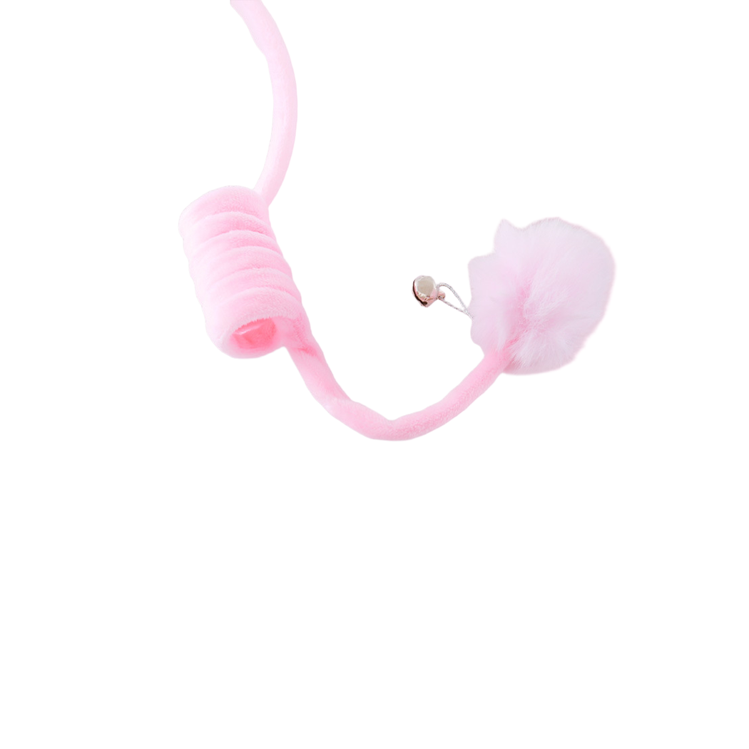 Close-up of the fuzzy pink pom-pom, small bell and coiled tether
