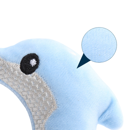 Close-up of the blue dolphin cat toy surface and embroidered side panel
