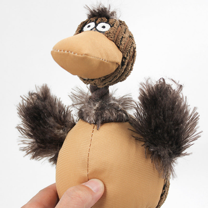 Close-up of the camel bird-shaped dog toy face, wings and body seam