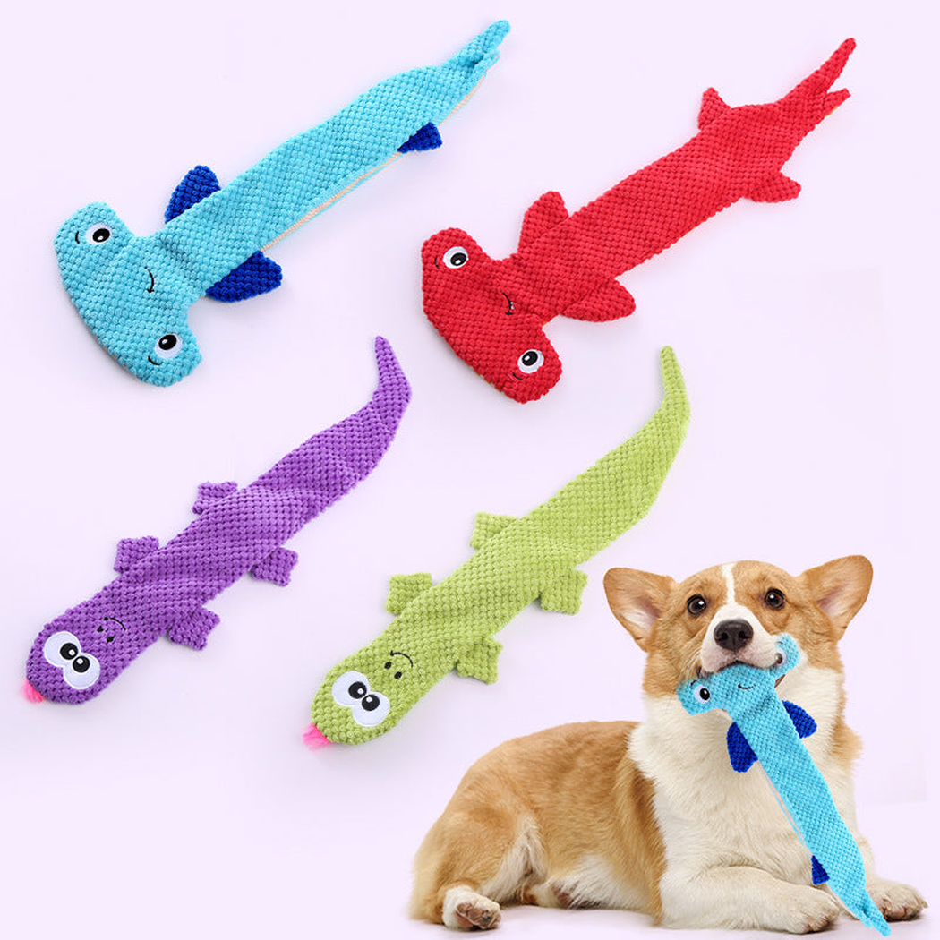 Dog holding a light blue animal-shaped toy beside red, purple, and green variants