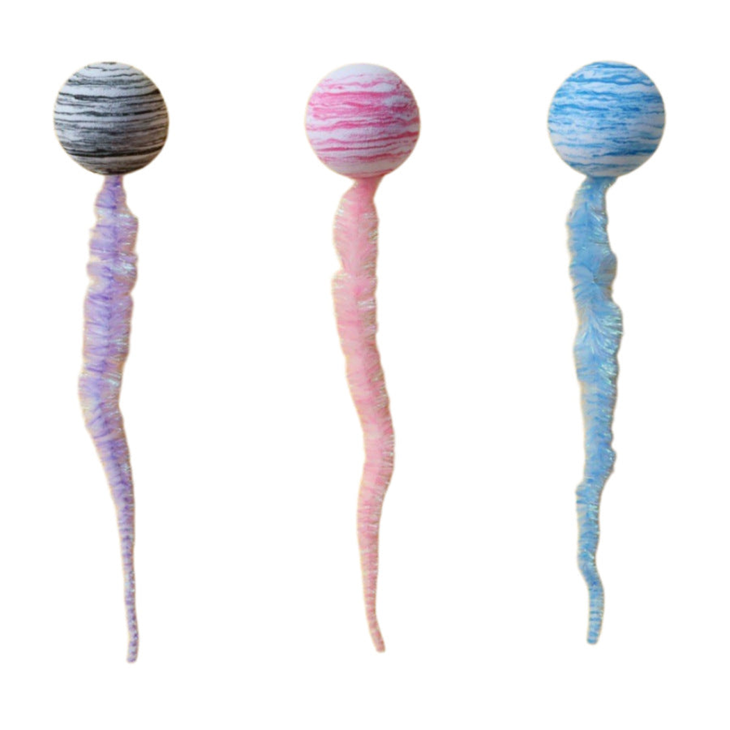 Gray, pink, and blue striped ball-and-tail cat toys on a white background