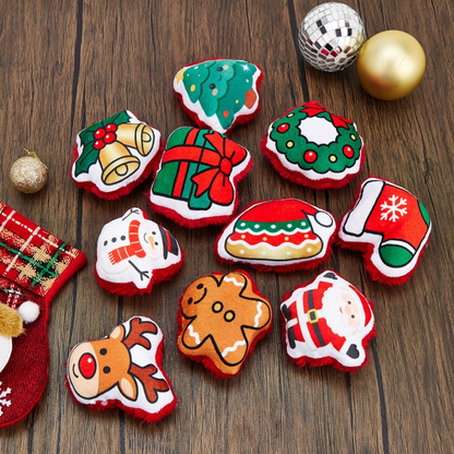 Nine Christmas-themed cat toys arranged on a wooden surface