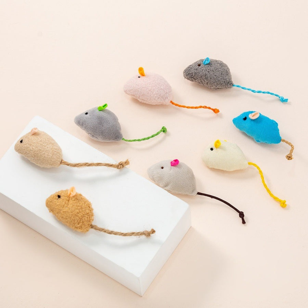 Eight mouse-shaped cat toys arranged on a raised display