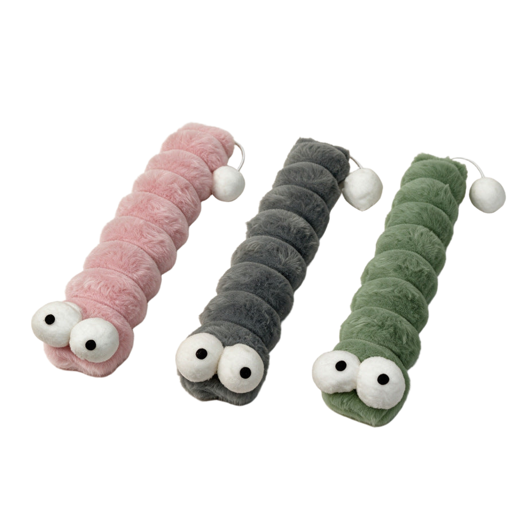 Green, pink and gray caterpillar-shaped cat toys displayed together