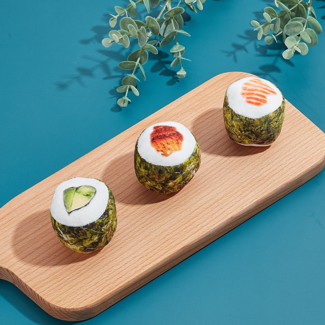 Salmon, Beef, and Vegetable sushi roll cat toys displayed together