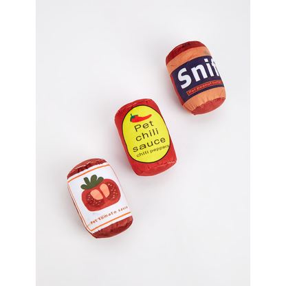 Tomato, Peanut Butter and Chili can-shaped cat toys displayed together