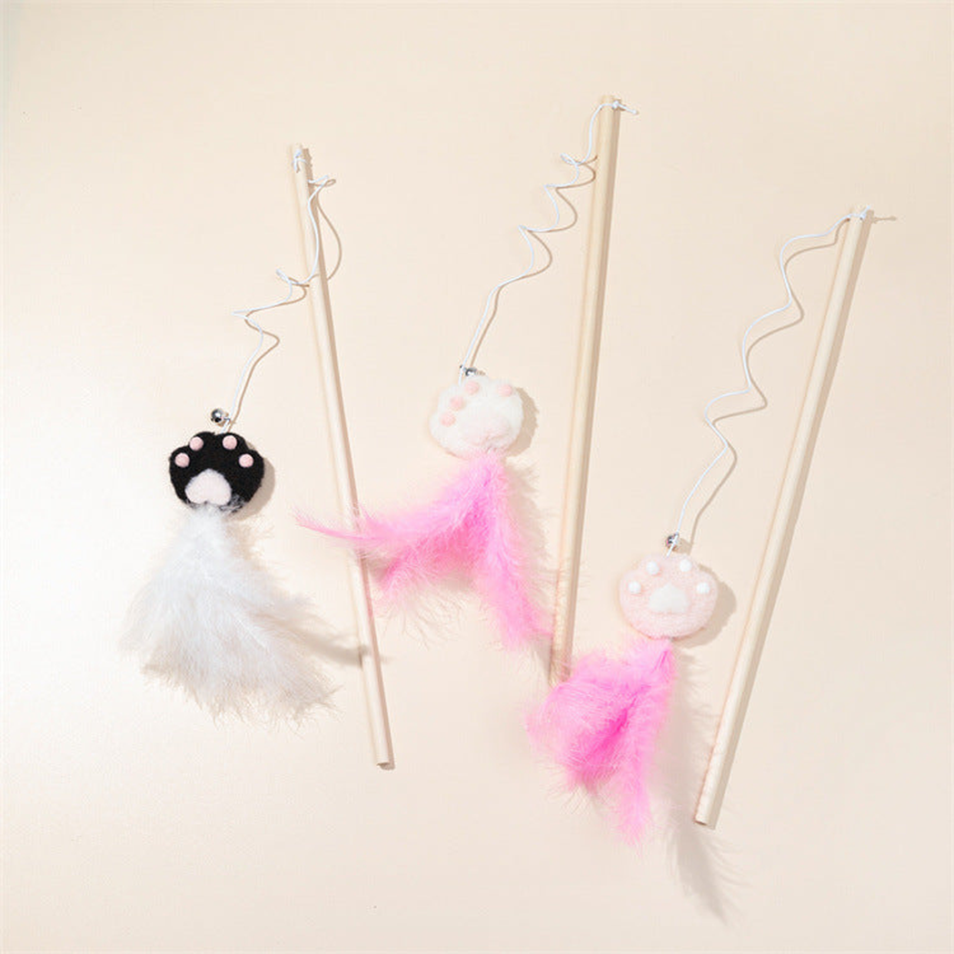 Three paw cat teaser wand styles arranged on a neutral background