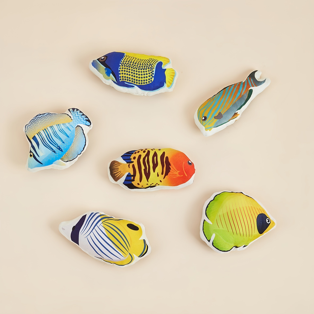 Six colorful fish-shaped cat toy styles arranged on a beige background