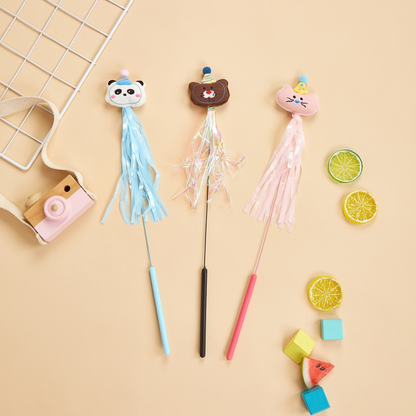 Bear, Panda and Cat teaser wands arranged with colorful props