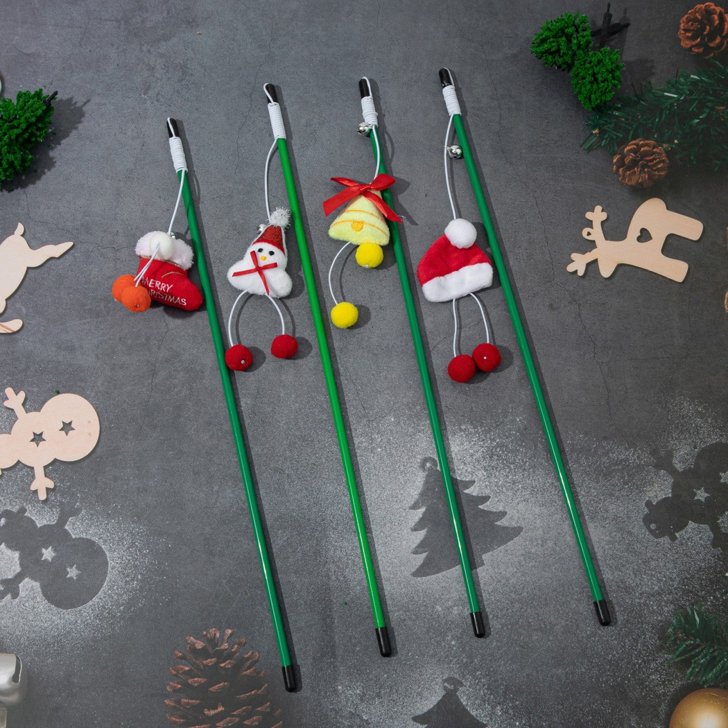 Four green Christmas cat teaser wands with hanging character ornaments