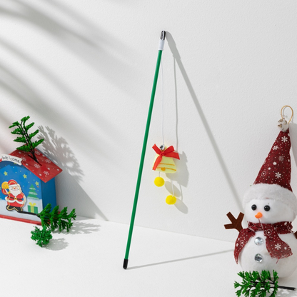 Green cat teaser wand with a yellow bell ornament, red bow and yellow pom-poms