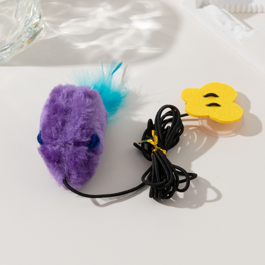 Close-up of the Purple mouse toy, cord, feather tail, and suction cup