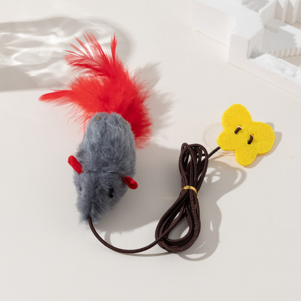 Close-up of the Gray mouse toy with stitched face and red feather tail