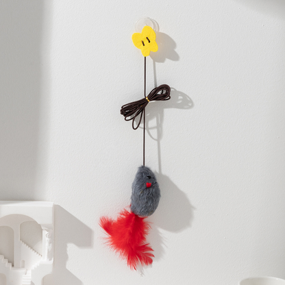 Gray hanging mouse cat toy mounted on a wall by its suction cup