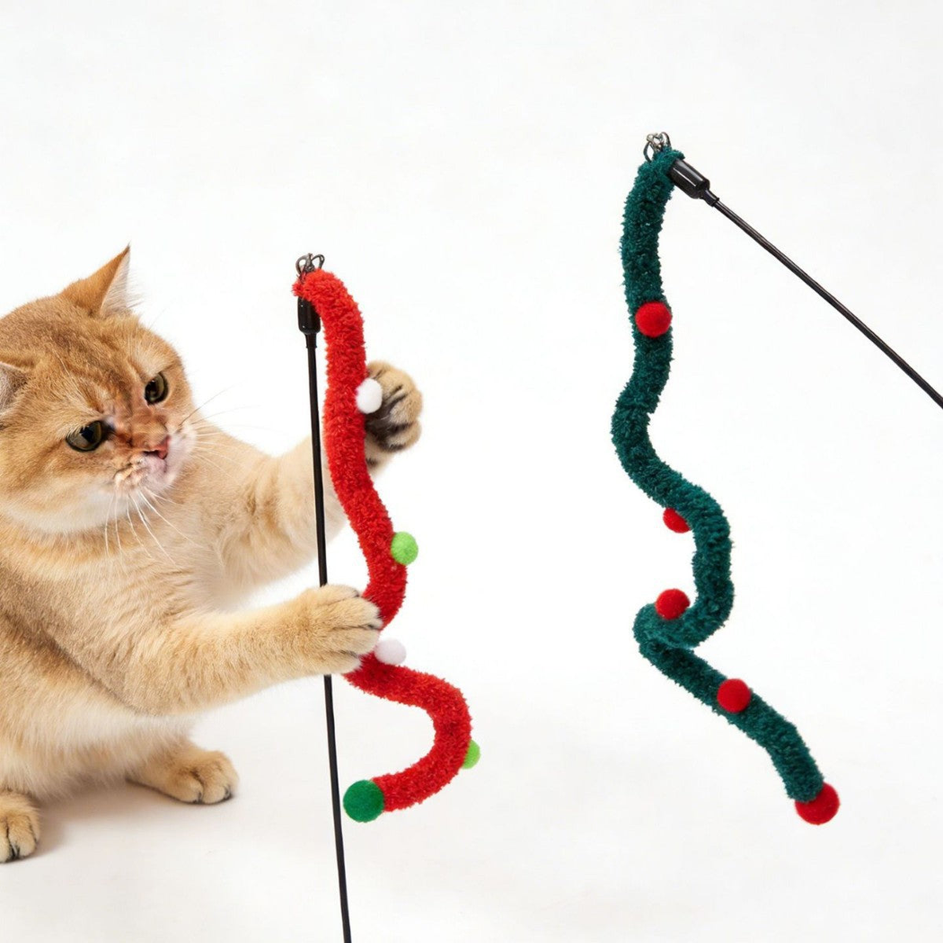 Cat batting at red and dark green wavy cat teaser wands