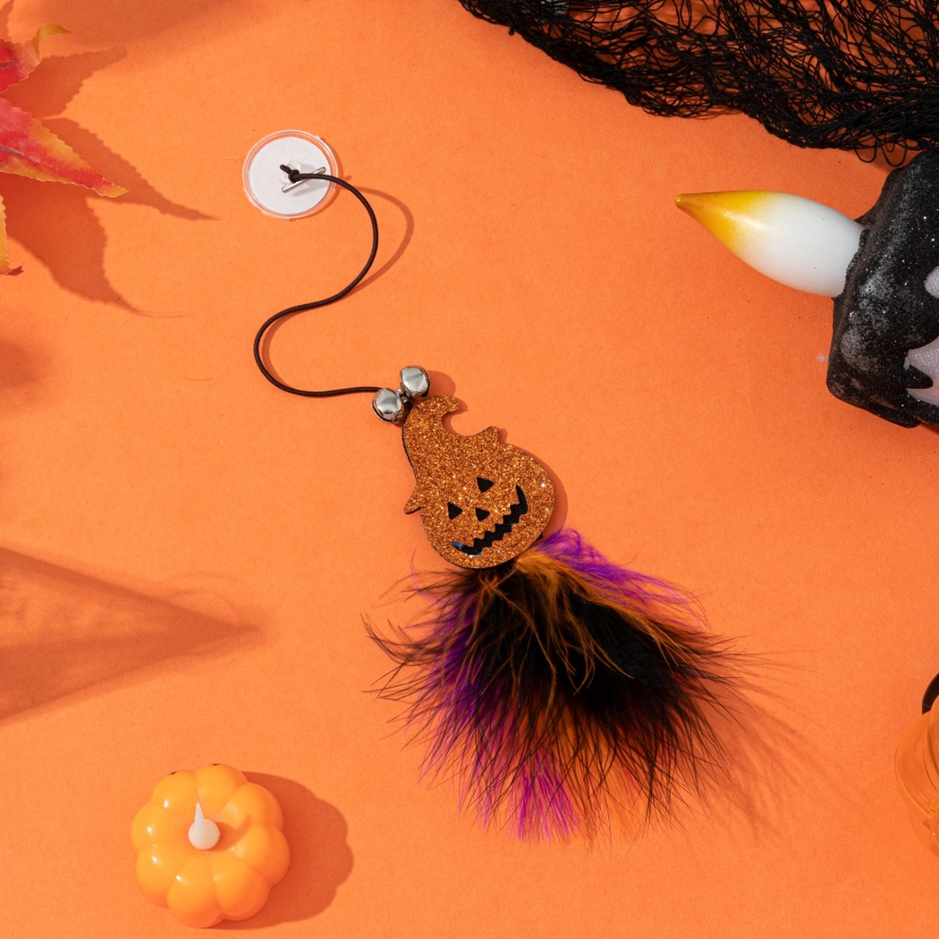 Jack-o'-lantern suction-cup dangling cat toy with bells and multicolor fluffy tassel