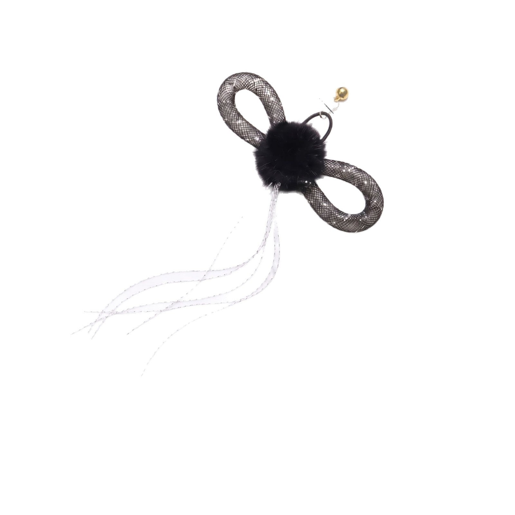 Butterfly-shaped cat toy with looped wings, fuzzy center, trailing strands and bell on a white background