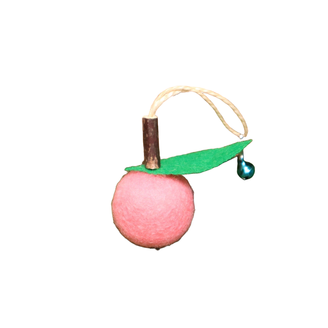 Pink fruit-shaped dangling cat toy with green leaf and bell