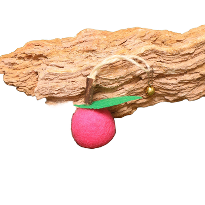 Fuchsia fruit-shaped dangling cat toy with green leaf and bell