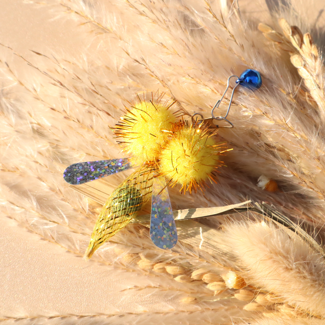 Yellow winged cat toy attachment with metal clip and blue bell