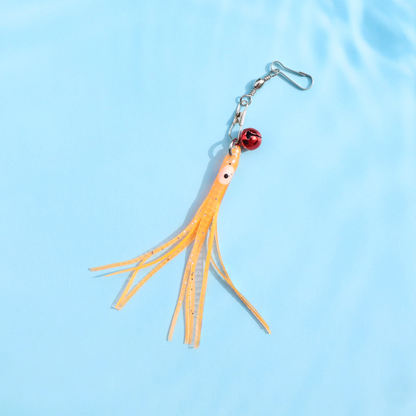 Orange octopus cat toy attachment with red bell and metal clip