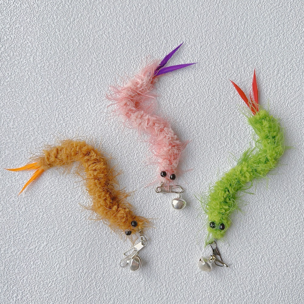 Green, Pink, and Brown fuzzy cat teaser replacement toys in curved views