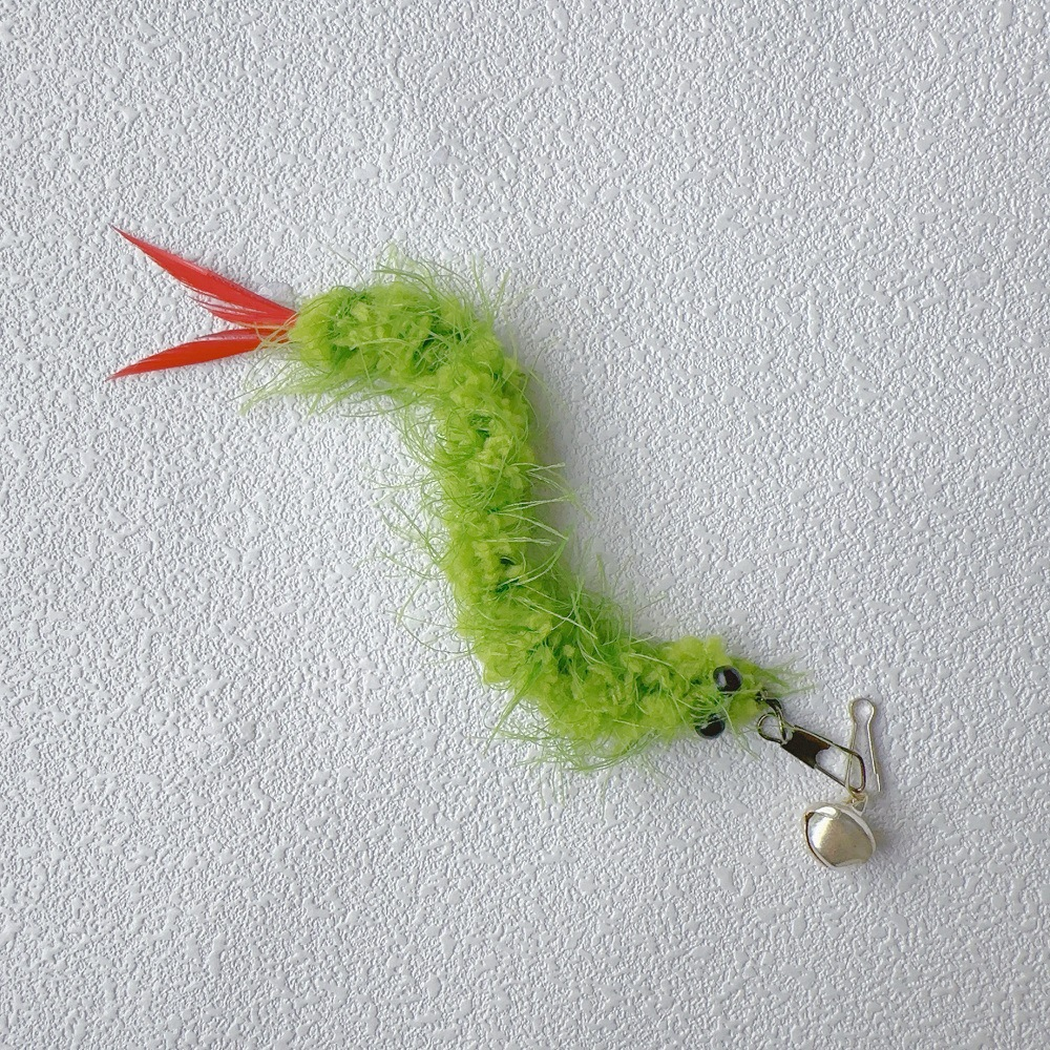 Green fuzzy cat teaser replacement toy with red tail feathers, clip, and bell