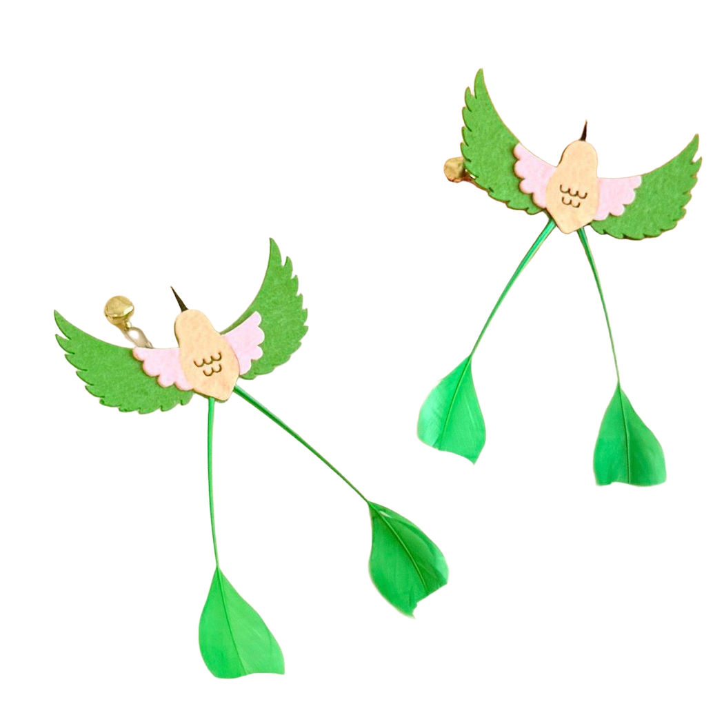 Two angled views of the green and pink long-tailed bird-shaped cat toy attachment