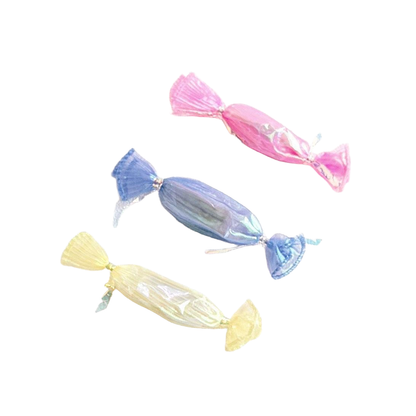 Pink, blue and yellow candy-shaped cat toys displayed together