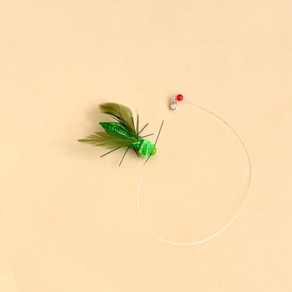 Green winged insect-shaped cat toy attachment with clear tether and clasp