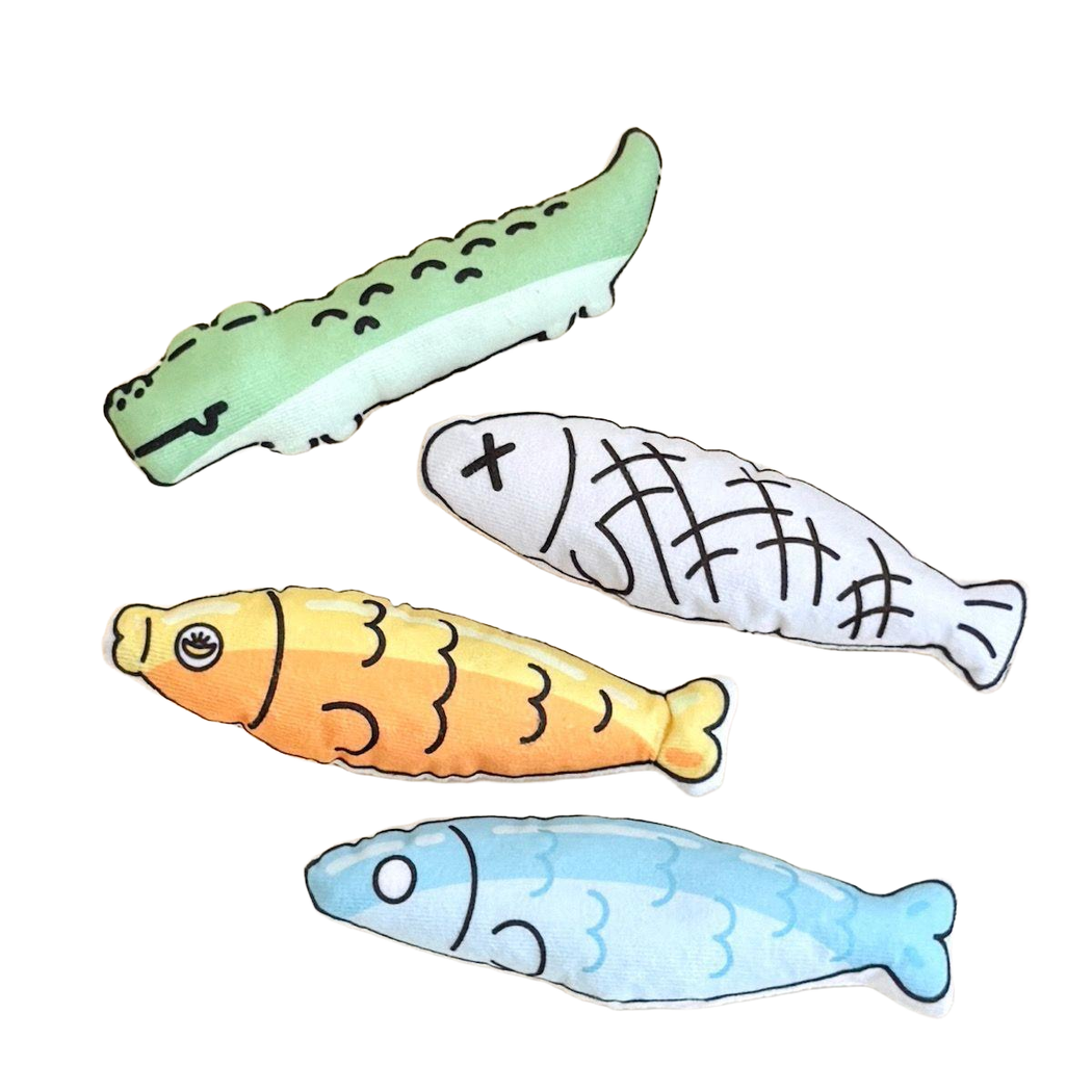 Crocodile and three fish-shaped cat toys displayed together