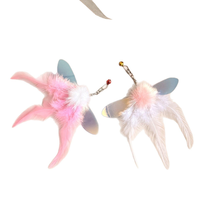 Pink and white feather cat toy attachments on a white background