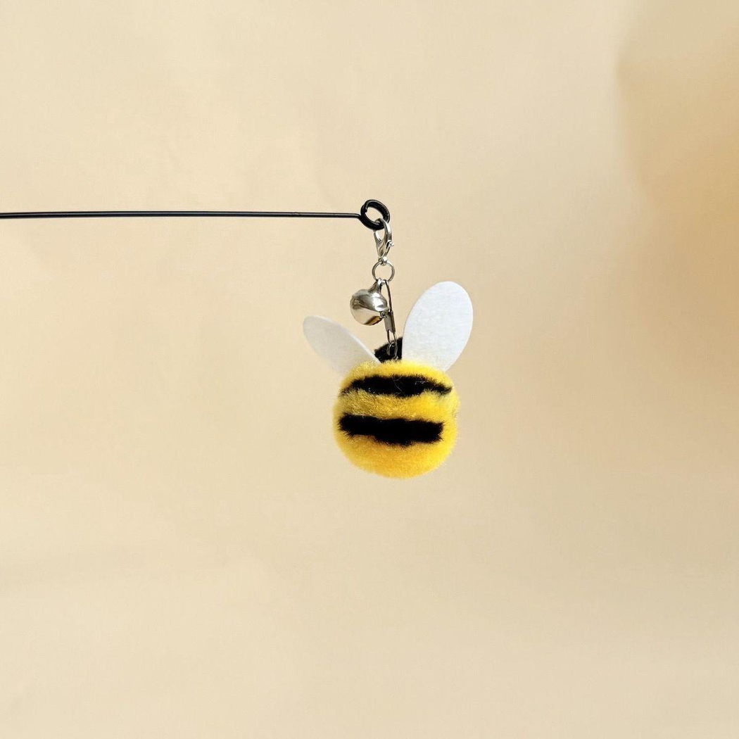 Yellow-and-black bee cat teaser attachment shown from the rear
