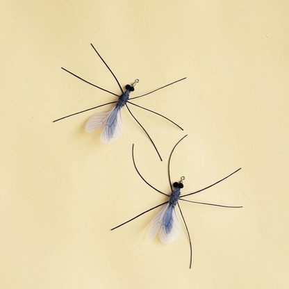 Two mosquito-shaped cat toy attachments displayed from opposite angles