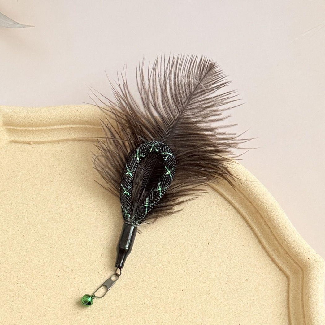 Dark feather cat wand attachment with black mesh loop and green bell