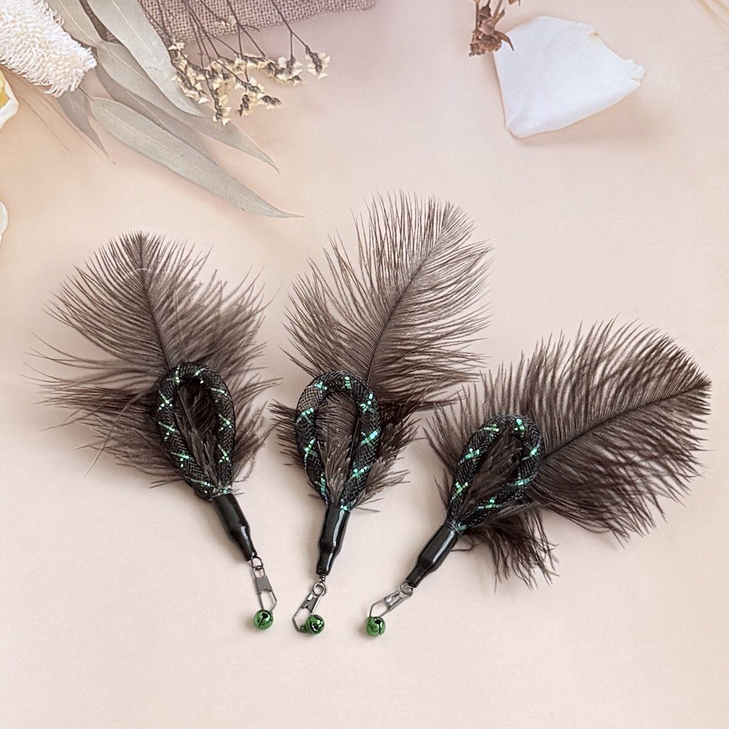Three dark feather cat wand attachments with green bells