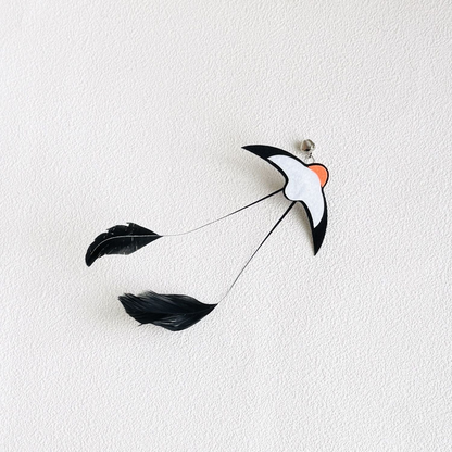 Swallow cat teaser attachment with bell and trailing black feathers