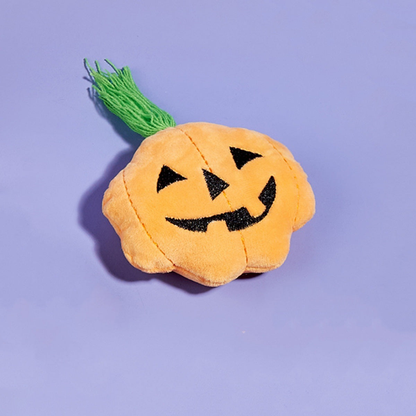 Pumpkin style orange cat toy with jack-o'-lantern face and green stem