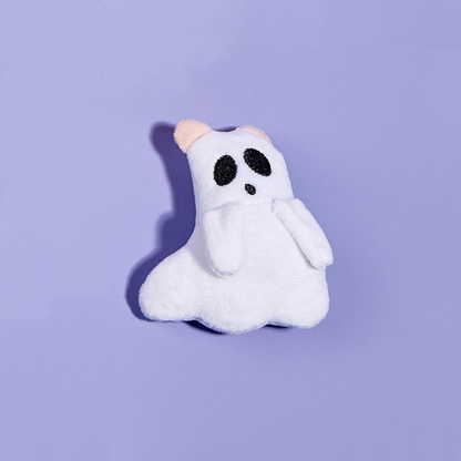 Ghost style white cat toy with black eyes and pink-tipped ears
