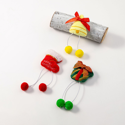 Gift, bell, and stocking pom-pom dangle cat toys displayed together