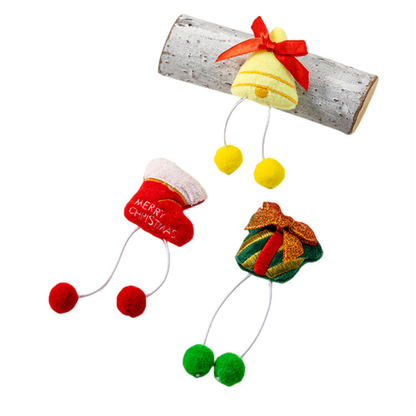 Gift, bell, and stocking pom-pom dangle cat toys on a white background