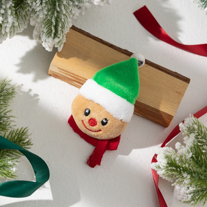 Smiling character cat toy with green hat and red scarf