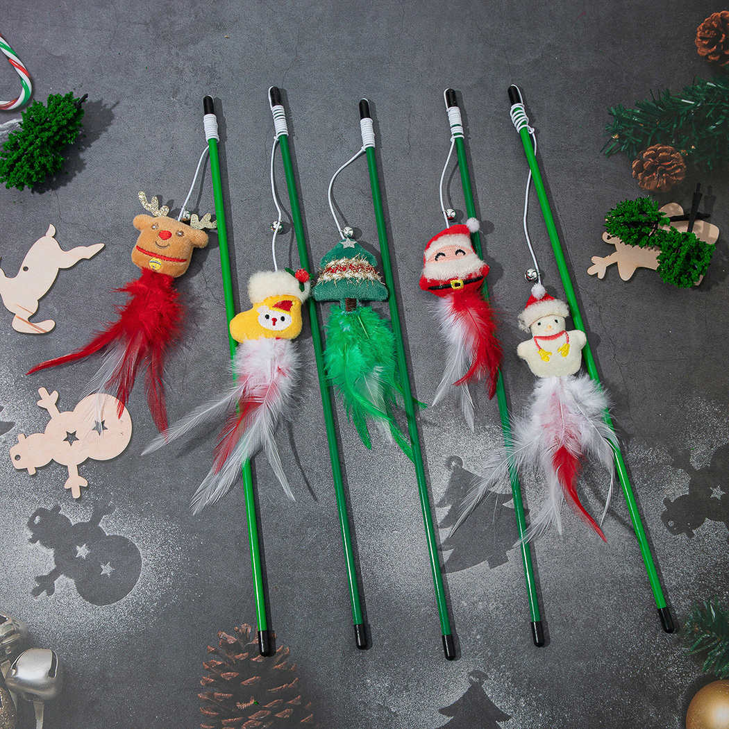 Five Christmas character cat teaser wands displayed with feather tails