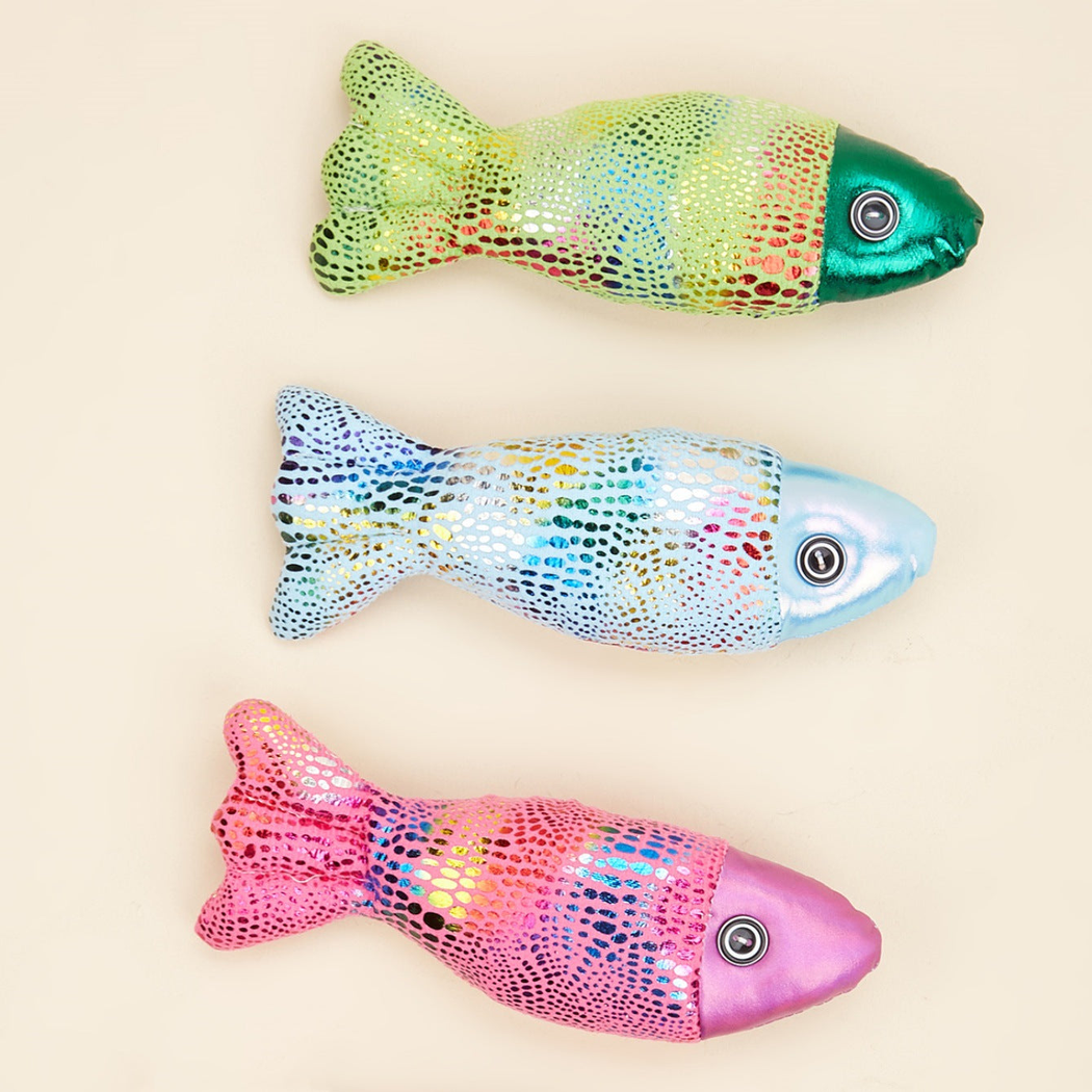 Green, light blue and fuchsia fish-shaped cat toys displayed together