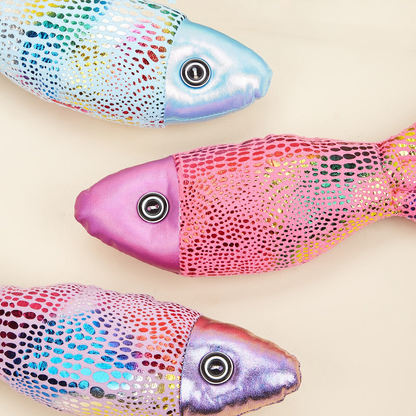 Close-up of metallic dotted patterns and round eye details on fish-shaped cat toys