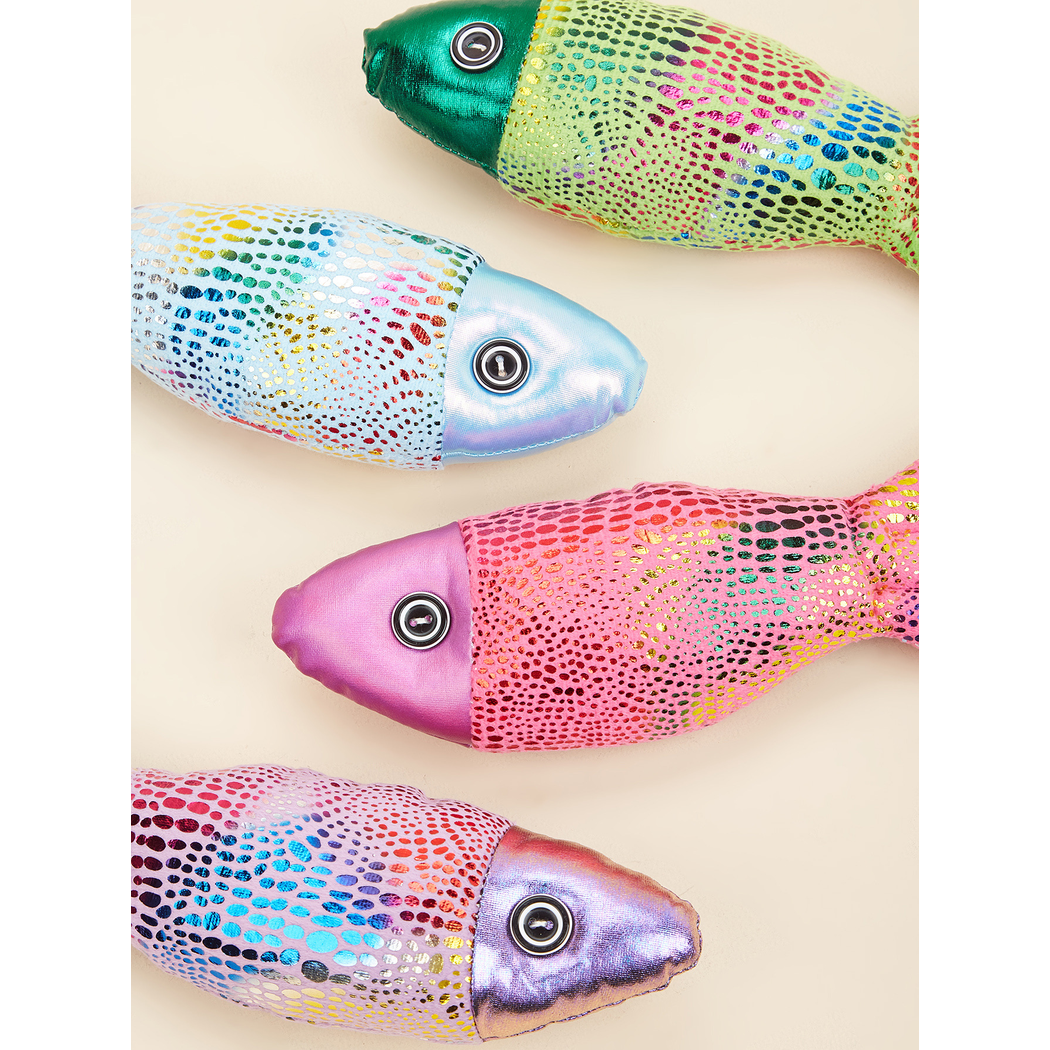 Close-up of metallic dotted surfaces and round eyes on four colorful fish-shaped cat toys