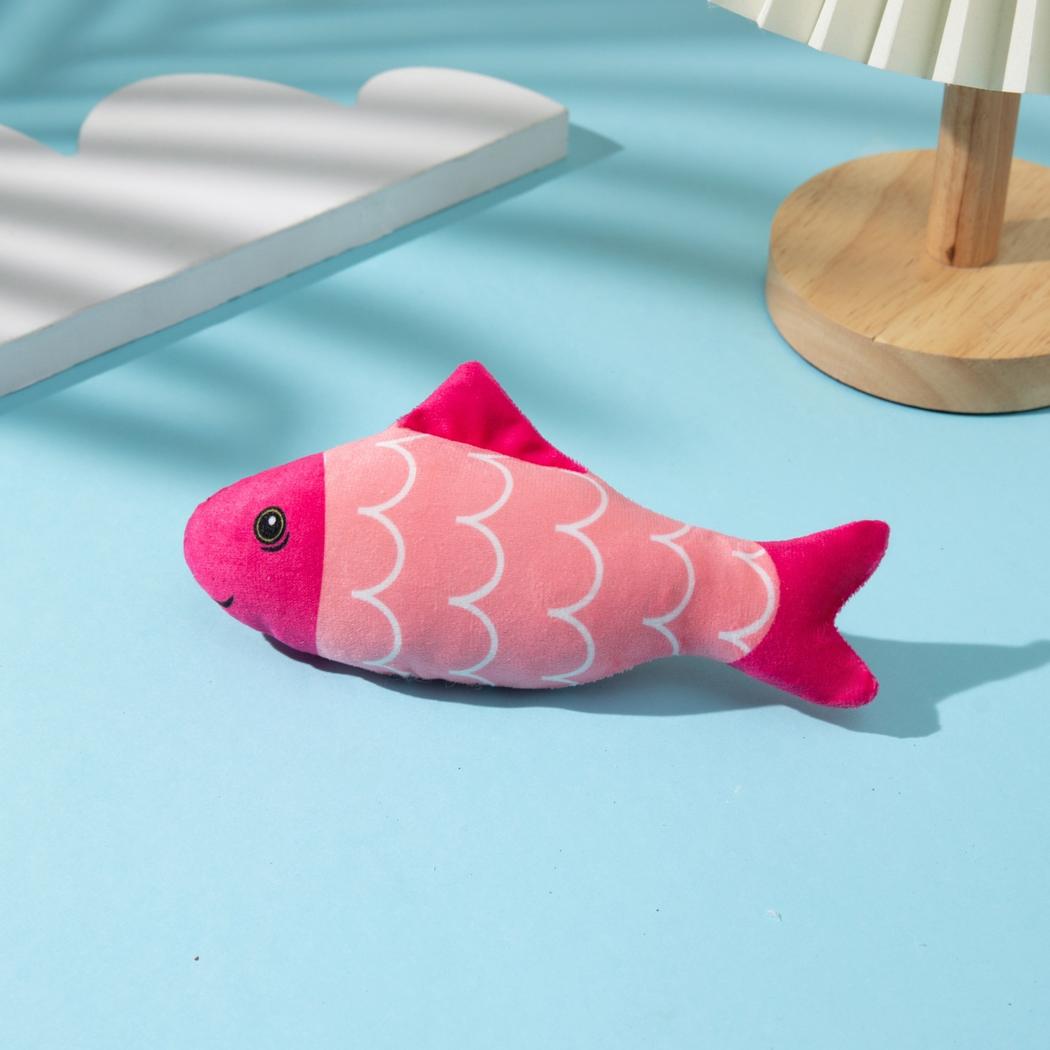 Waves fish-shaped cat toy in pink with white scalloped lines